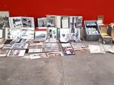 a lot of books and pictures on the floor