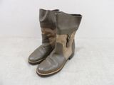 leather boots with zippers and buckles on the side of them