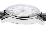a close up of a watch on a white surface
