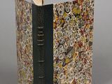 a book with a bookmark on it sitting on a table