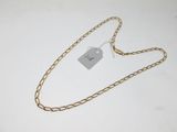a close up of a gold chain with a tag on it