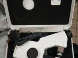 a white and black box with a microscope in it