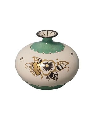 a white and green vase with a flower design on it