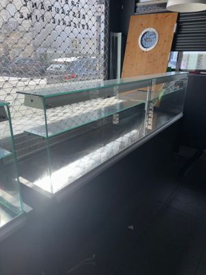 a glass display case in the middle of a room