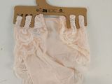 a baby diaper on a hanger on a wall