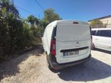 a white van that is parked next to a white van