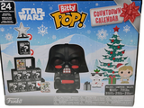 Une figurine de Dark Vador sort de sa boîte, avec un sapin de Noël en arrière-plan