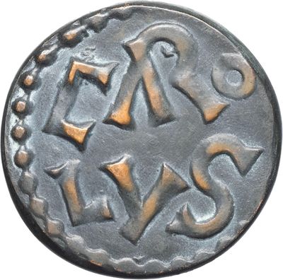 a close up of a coin with the word eaa on it