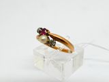 a gold ring with a pearl and garnett on it