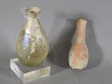 two vases sitting next to each other on a table