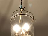 a light that is hanging from the ceiling in the room