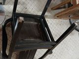 a chair that is sitting on the floor next to a table