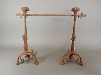 pair of antique cast iron candlesticks with wooden handles