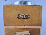 a close up of a wooden object with a metal object on top of it