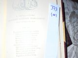 an open book with writing on it sitting on a bed