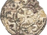 a close up of a coin on a white surface