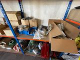 many boxes and boxes on a shelf in a room