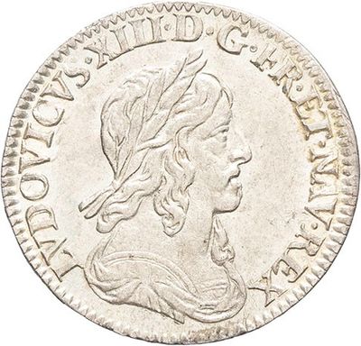 a silver coin with a woman ' s head on it