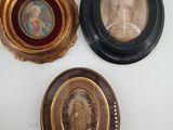 three framed pictures of a woman and a child in a gold frame