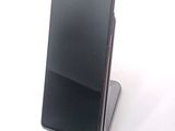 a cell phone that is sitting on top of a stand
