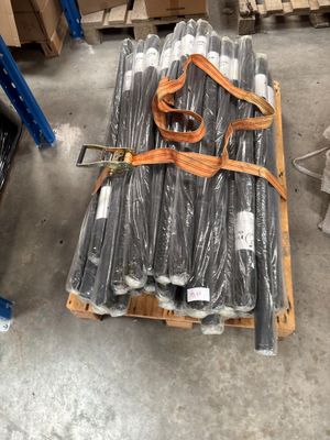 a pallet with a bunch of pipes on it in a warehouse