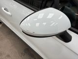 an image of a side view mirror on a white car