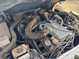 a car engine with a lot of wires in it