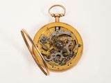 an image of a pocket watch with a gold case on a white background