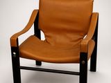 an image of a brown leather chair on a white background