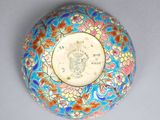 a blue and orange bowl with a bird on it