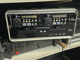 an image of a rack of audio equipment in a room