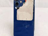 the back of a blue phone with a piece of paper on it