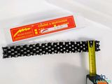 a tape that has been cut in half to make a chain strap