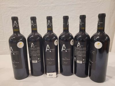 six bottles of wine are lined up in a row on a table