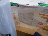 packaging for a vacuum cleaner and a roll of toilet paper