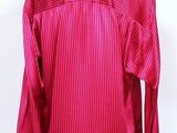 a mannequin mannequin wearing a red striped shirt