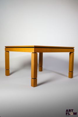 a small wooden table with two legs on a white background