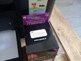 a printer and a box on a wooden pallet