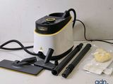 a vacuum that is sitting on a table next to some cleaning supplies