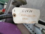 a label on a piece of paper attached to a machine