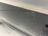 a close up of a car door with a hole in it