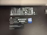 the back side of a laptop with a sticker on it