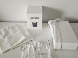 a white box and a white bag on a table