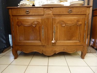 a wooden cabinet with a mirror on top of it