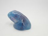 a blue object that is sitting on a white surface