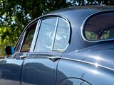 a close up of a car with a dog in the passenger seat