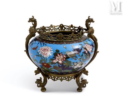 a blue vase with flowers on it on a stand