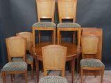set of six dining chairs and a table with a leopard print upholstered seat