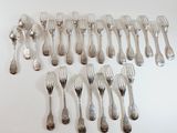 a lot of forks and spoons on the table