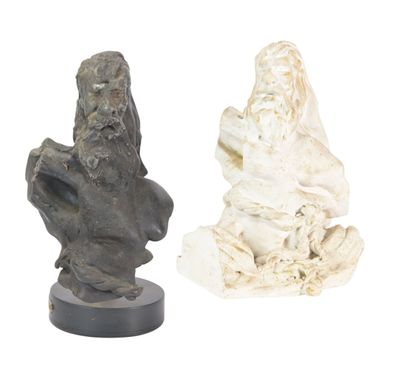 two statues of a man and a woman on a white background